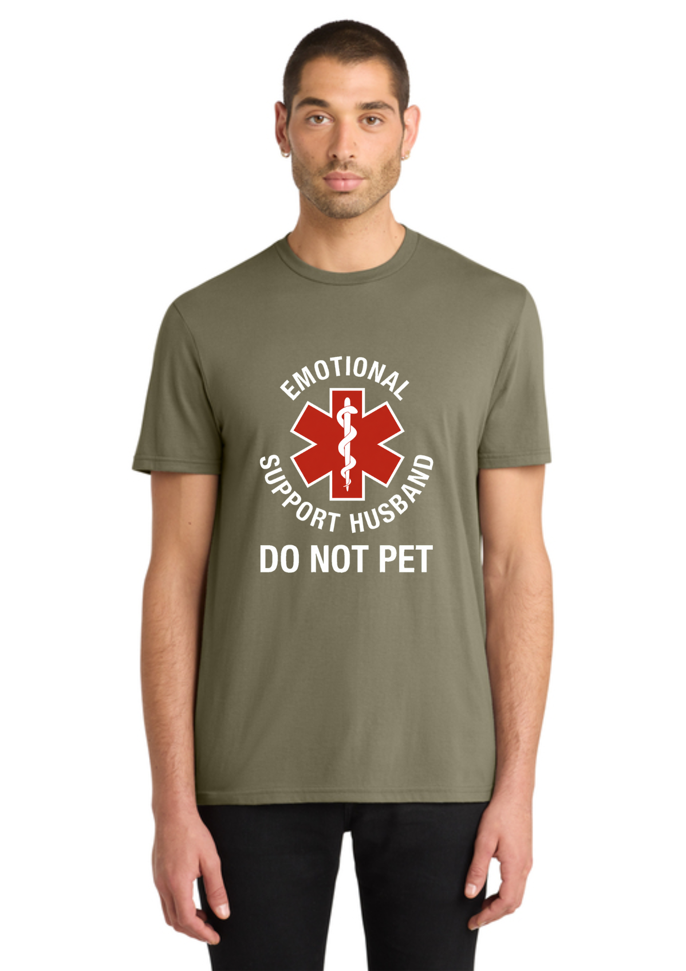 A man wearing an olive green t-shirt with a graphic that reads 'EMOTIONAL SUPPORT HUSBAND DO NOT PET' around a red Star of Life symbol, shown against a plain white background.