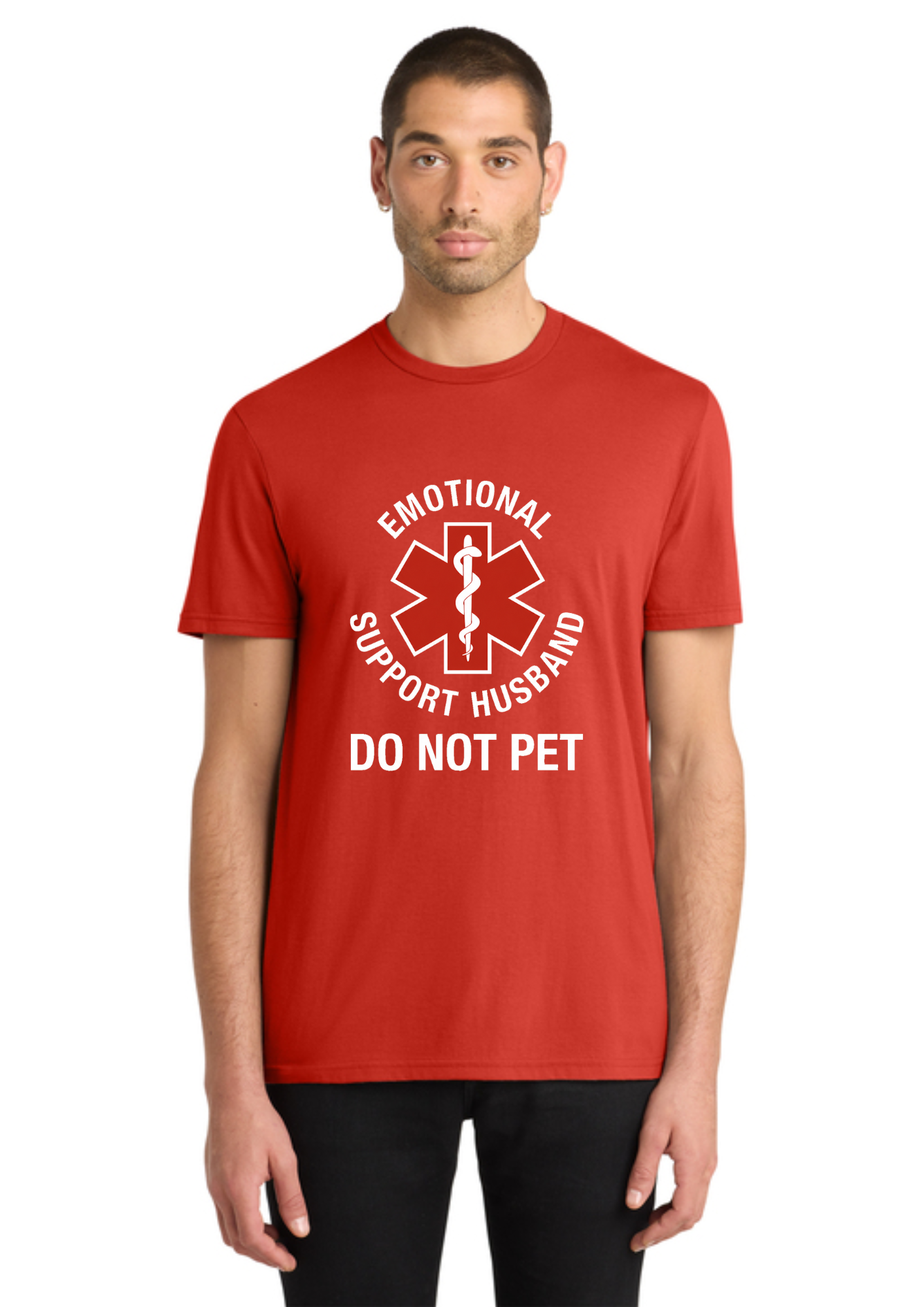 A man wearing a red short-sleeve t-shirt with a white graphic print that reads 'EMOTIONAL SUPPORT HUSBAND DO NOT PET' around a star-of-life medical symbol, photographed against a plain white background.